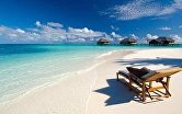 Виллы и пляж спа-отеля Conrad Maldives