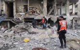 Последствия израильских ударов на улице Машталь в Газе